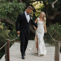 Discover Maria & Adrè’s elegant black tie wedding in Gansbaai, South Africa featuring the versatile ÉLYSÉE Enya gown, romantic outdoor vows, and timeless summer wedding inspiration.