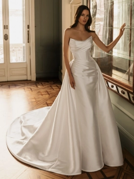 ÉLYSÉE Bridal HADLEY luxury satin wedding dress featuring a softly draped strapless neckline, sculpted corset bodice, Basque waist, elegant A-line skirt and sweeping cathedral train.