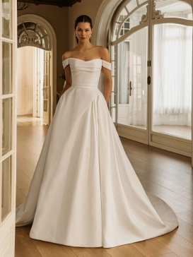 ÉLYSÉE Bridal HALIMA luxury Mikado ball gown wedding dress featuring an off-the-shoulder sweetheart neckline, softly draped bodice, elegant pleated skirt and sweeping cathedral train.