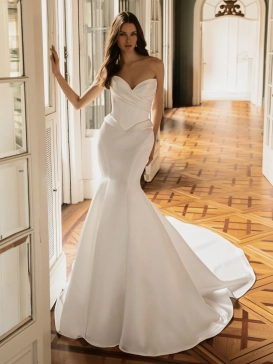 ÉLYSÉE Bridal HARLEEN luxury crepe mermaid wedding dress featuring a strapless sweetheart neckline, sculpted corset bodice, Basque waist, elegant draping and a cathedral train.