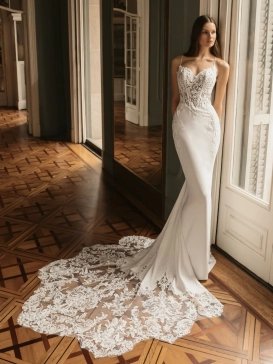 ÉLYSÉE Bridal HARRIET luxury crepe fit-and-flare wedding dress featuring delicate spaghetti straps, an illusion lace corset bodice, floral appliqués and a dramatic lace cathedral train.