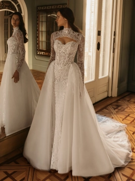ÉLYSÉE Bridal HAZEL luxury lace fit-and-flare wedding dress featuring a strapless sweetheart neckline, removable illusion lace bolero, dramatic tulle overskirt and cathedral train.