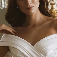 GARNET wedding dress by Elysee Bridal featuring intricate lace bodice, delicate straps, and flowing tulle fit and flare skirt. Elegant bridal gown for modern romantic brides seeking timeless lace wedding dress with flattering silhouette and soft tulle